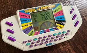 1995 Tiger Electronics Wheel Of Fortune Handheld LCD Video Game Plus Cartridge 1